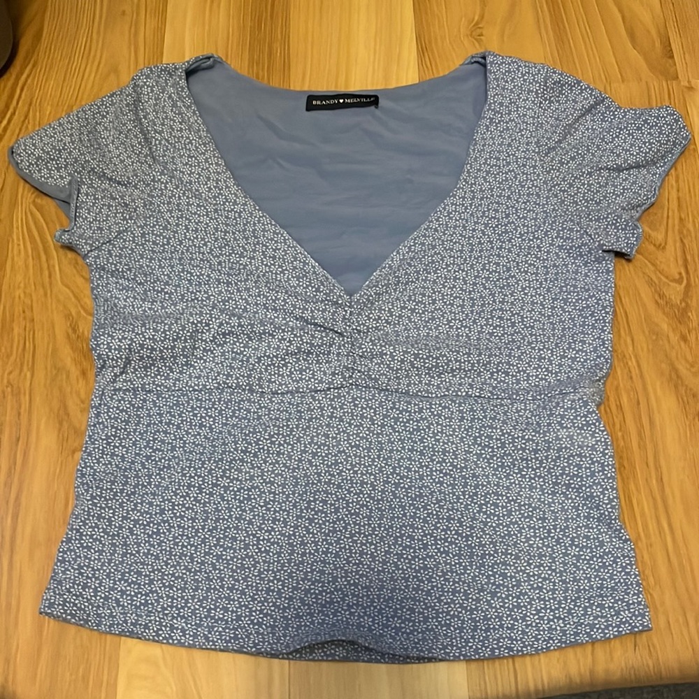 Brandy Melville Gina cropped blue shirt with white flowers- originally $20
